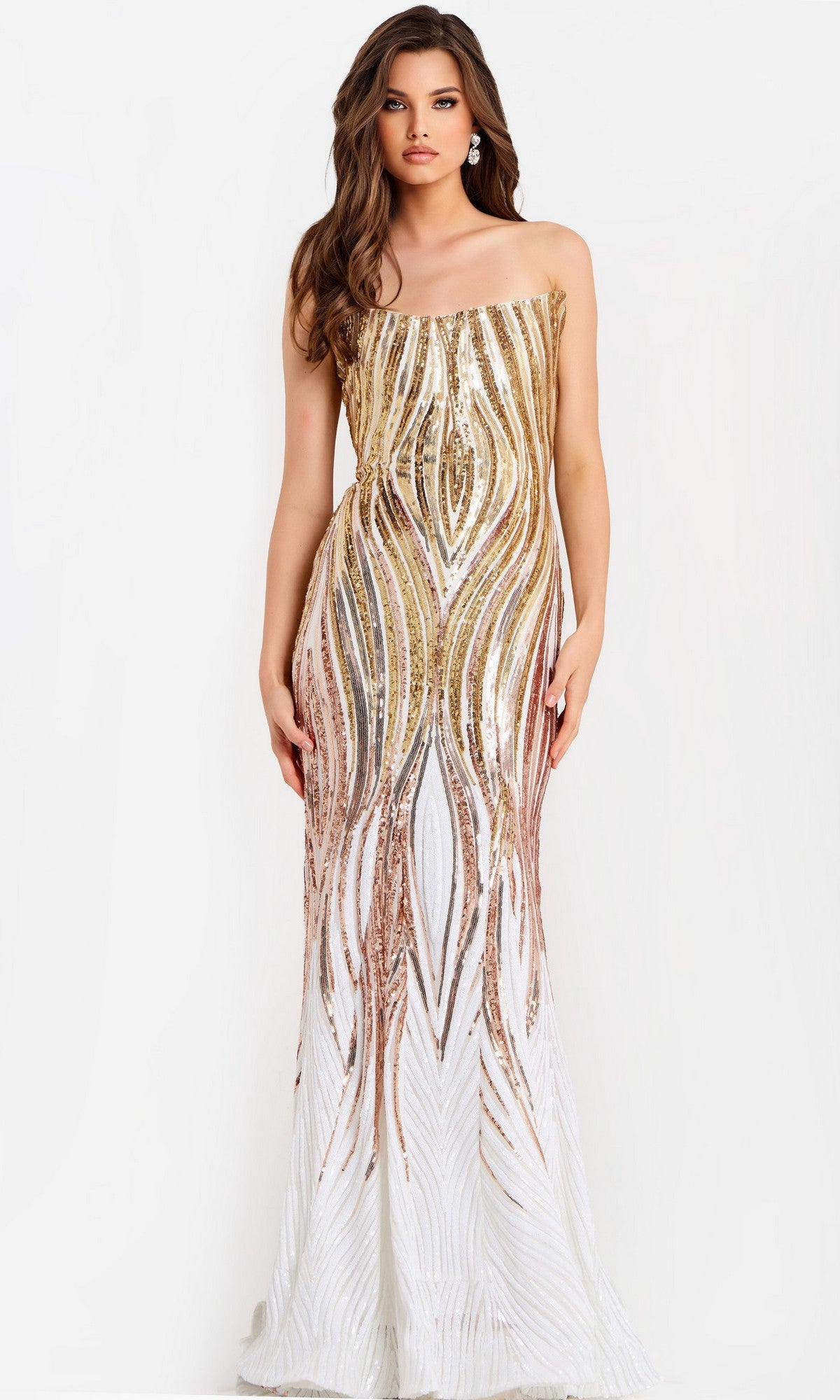 A woman models the Long Prom Dress: Jovani 43854, featuring a strapless corset bodice and gold and white sequin details in a floor-length design, standing against a plain white background.